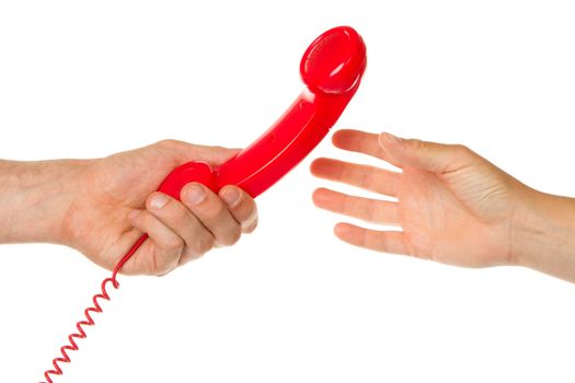 Man giving an old red telephone to a woman