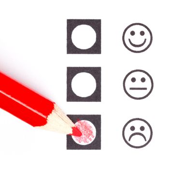 Red pencil choosing the right smiley (mood)