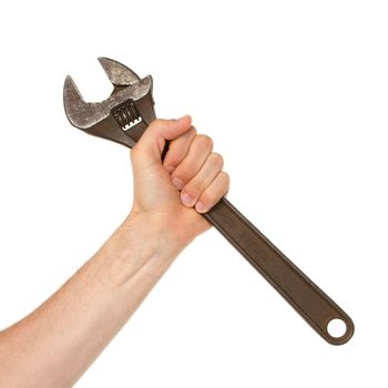 Old rusted adjustable vector wrench in a hand (isolated on white)
