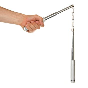 Hand holding a metal nunchaku on white background