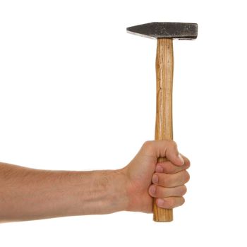 Man holding a old wooden hammer, isolated on a white background