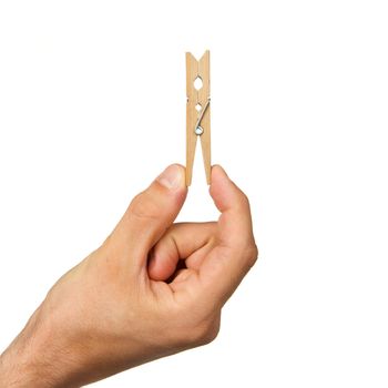 Hand holding clothes peg on white background