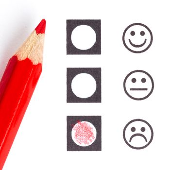 Red pencil choosing the right smiley (mood)