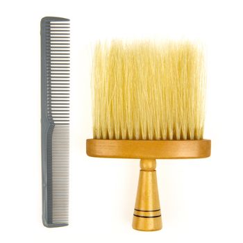 Hair brush for barber and a grey comb isolated on a white background