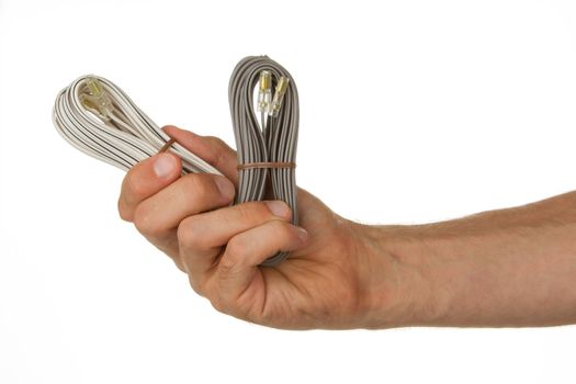 Speaker cable in a hand, isolated on a white background