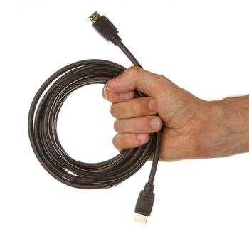 Close-up of hdmi cable in a hand on white background