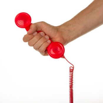 Man holding a red telephone, isolated on white