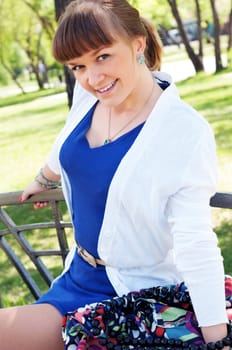 portrait of a beautiful woman, spending time in a summer park