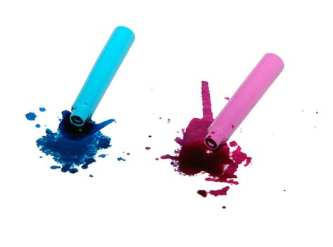 Spilled blue and pink ink spatter from pen cartridges