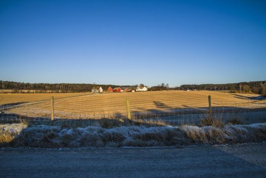 Rokke in Halden municipality is a rural village with several large farms and the image that is shot in december 2012 shows a typical large norwegian farm