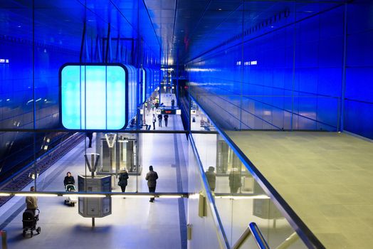 HAMBURG - DECEMBER 2, 2012: First passengers are using the new underground station “Hafencity University” in Hamburg Hafencity on December 2, 2012 in Hamburg Germany. The station connects the exciting newly built area of Hafencity with the rest of Hamburg – currently the public can test drive the line for free before the station is officially connected with the timetable of the underground.