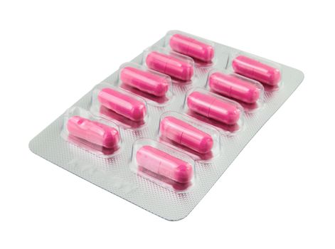 Pink pills pack on white background