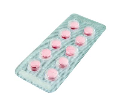 pack of pink pills on white background