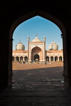 DELHI, INDIA - DECEMBER 1: people walks in the courtyard of Jama Masjid, a major tourist attraction and the largest and best known mosque in india on Dec 01, 2012 in Delhi, India 