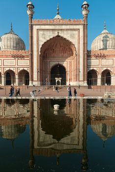 DELHI, INDIA - DECEMBER 1: people walks in the courtyard of Jama Masjid, a major tourist attraction and the largest and best known mosque in india on Dec 01, 2012 in Delhi, India 