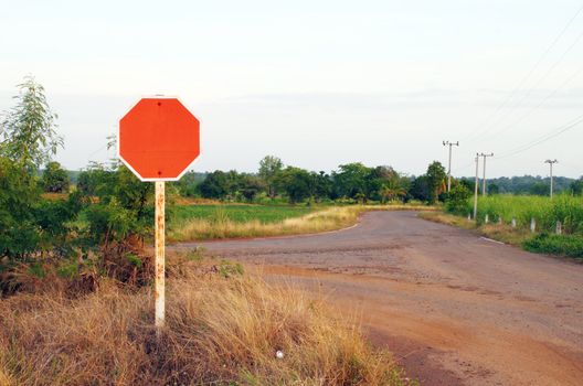 red blank sign in a country road