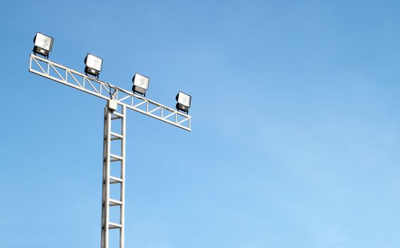 Spot light pole with blue sky