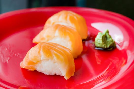 salmon sushi on plate, japanese style cuisine .
