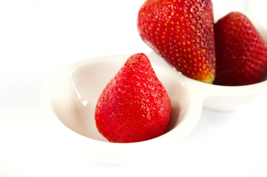fresh red strawberry on white bowl