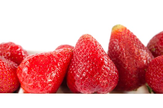 Fresh strawberries in bowl on white background