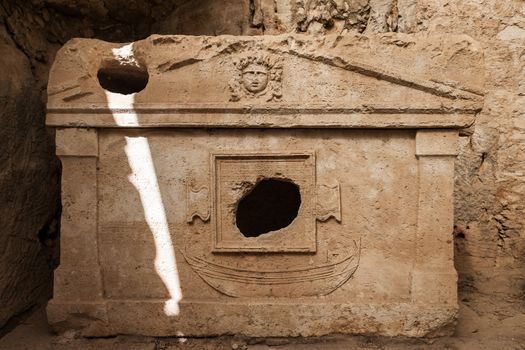 Ancient harbour monumental tombs sarcophagus at Turkey Olympos city ruins