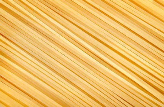 Photo of the yellow raw pasta background