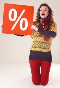 Young attractive woman with red percent sign for the final sale