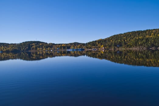 Image is shot by Iddefjord in Halden, Iddefjord borders both to Sweden and Norway