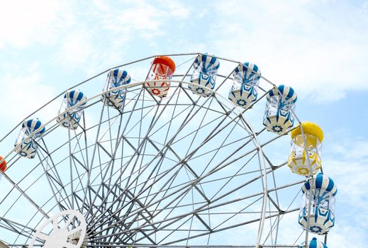 colored Ferris wheel with sky background