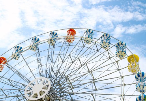 colored Ferris wheel with sky background