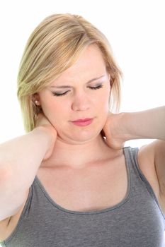 Woman with a crick in her neck or stiffnes caused by stress and tension massaging the back of her neck with her hands to relieve the pain