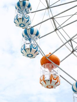 colored Ferris wheel with sky background