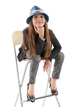 Young Fashion Girl Posing on Chair isolated on white background