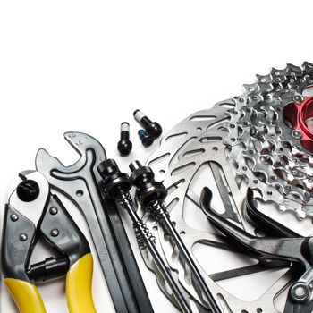 Mountain bike tools and spares on white background