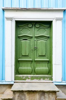 Old weathered green wooden door