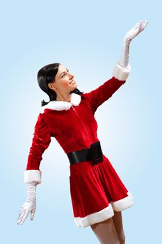 Santa Girl presenting your product, in costume and white gloves