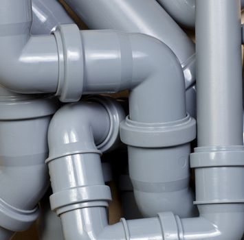 Grey PVC sewer pipes background