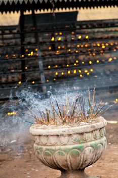 Burning incense sticks in a buddhist temple in Sri Lanka