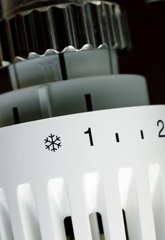 Thermostatic radiator valve set to minimal temperature close-up