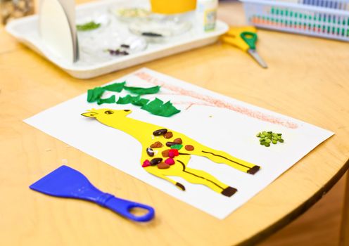 Children's applique work art items on a table