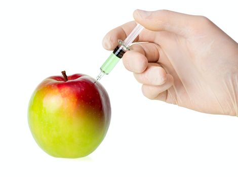 Green apple receiving an injection for rapid ripening