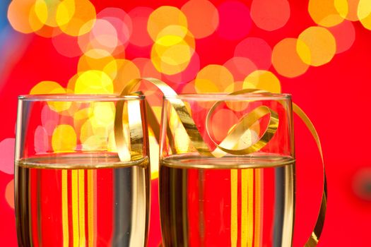 Two glasses of champagne with blured lights in background, very shallow DOF
