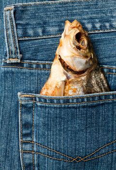 Blue jeans pocket with dried fish