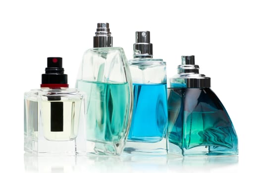 Assorted perfume bottles on white background, selected focus