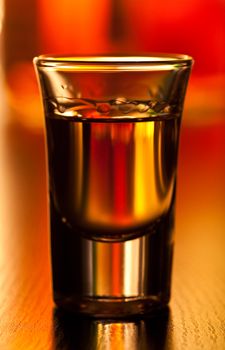 Shot glass on a table, shallow focus