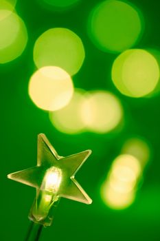 Star shaped Christmas light with blured lights in background, very shallow DOF