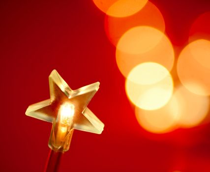 Star shaped Christmas light with blured background, very shallow DOF