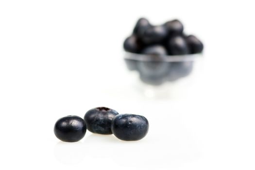 Blueberries on white background, shallow DOF