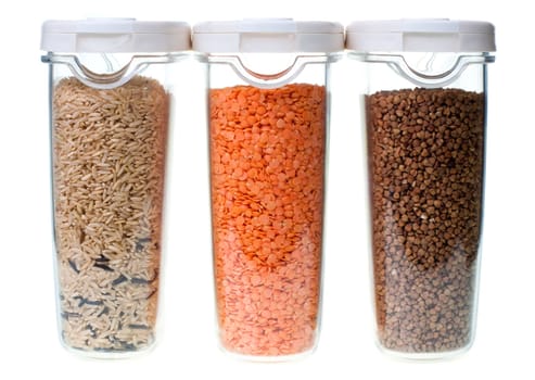 Rice red lentil and buckwheat in containers on white background