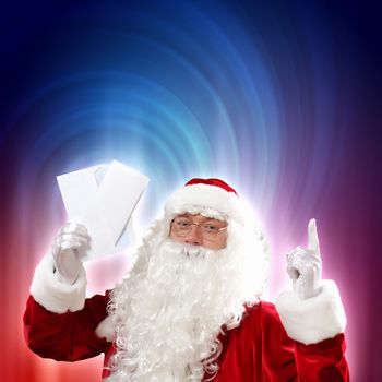 Santa holding Christmas letters and looking at camera